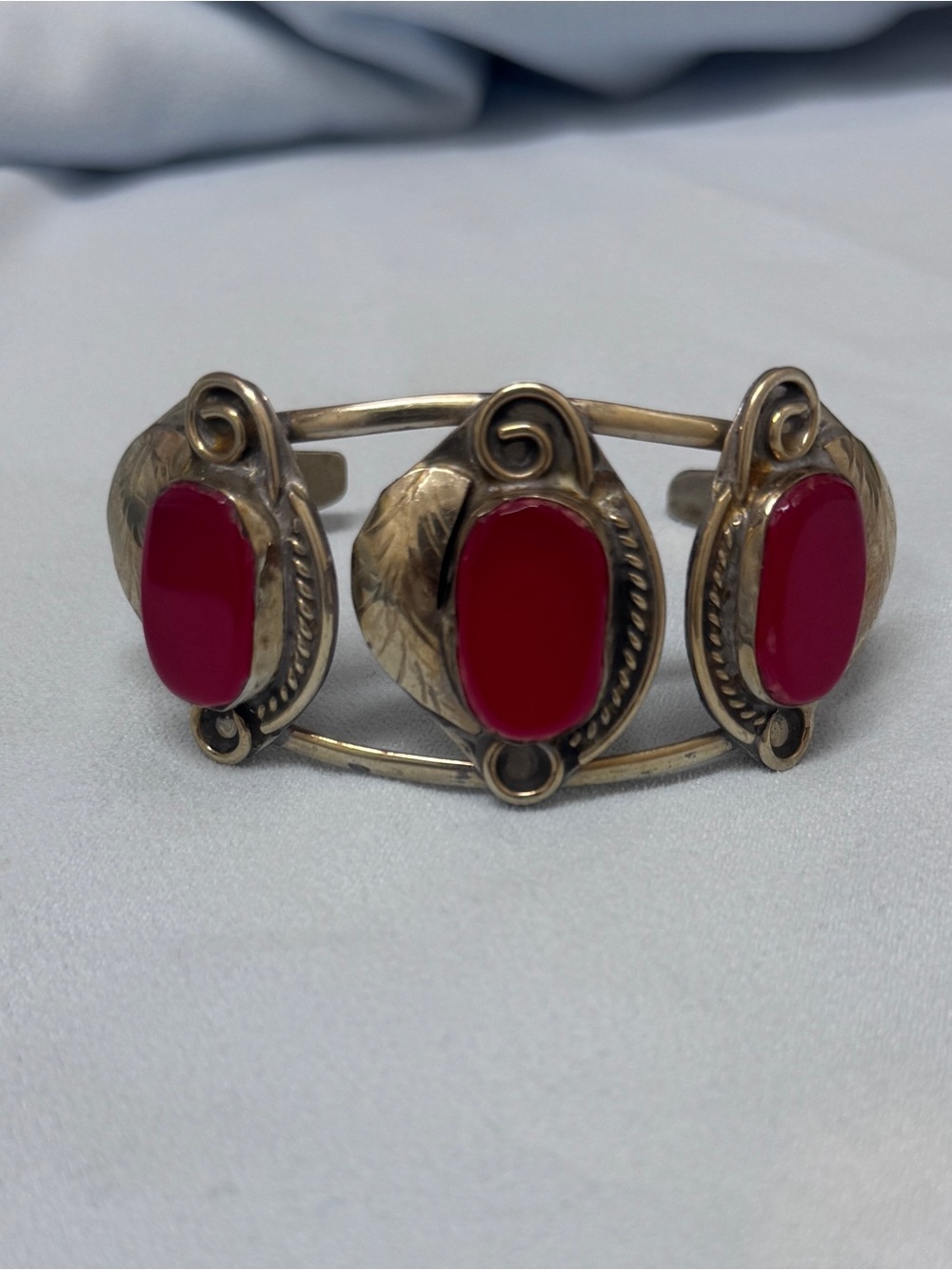 Vintage Southwestern Sterling Silver cuff with three vibrant red coral stones